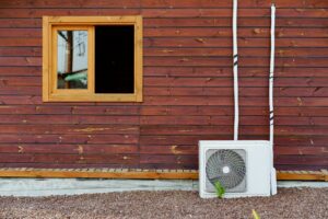 Air conditioner block on wall of building outdoors